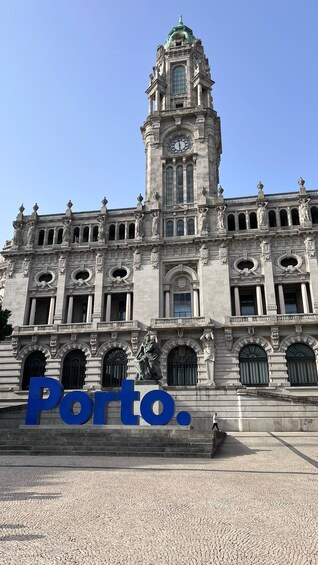 A historic building with a clock tower and statues, labeled 'Porto.' 3