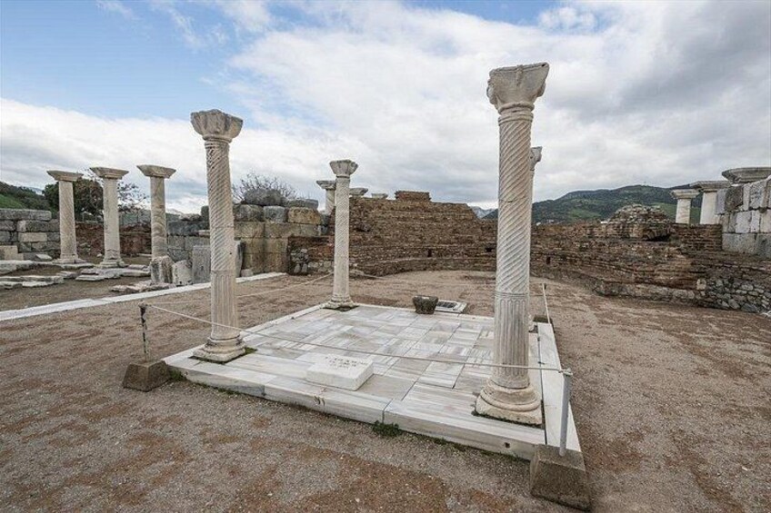 Ancient ruins with columns and stone structures. 5
