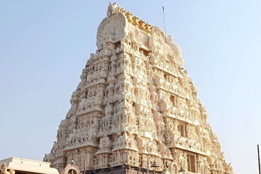A detailed temple with intricate carvings and a spire. 4