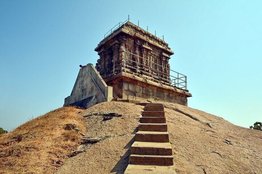 A stone staircase leading to a temple under construction. 2