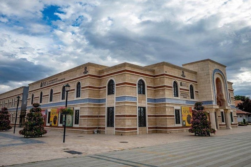 A historic building with arched windows and a tiled facade. 5