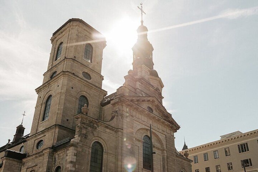 A church with a bell tower and a steeple under a clear sky. 4
