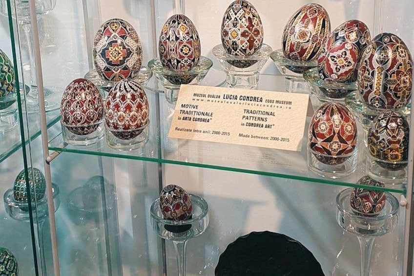 A display of intricately decorated eggs in a museum. 5
