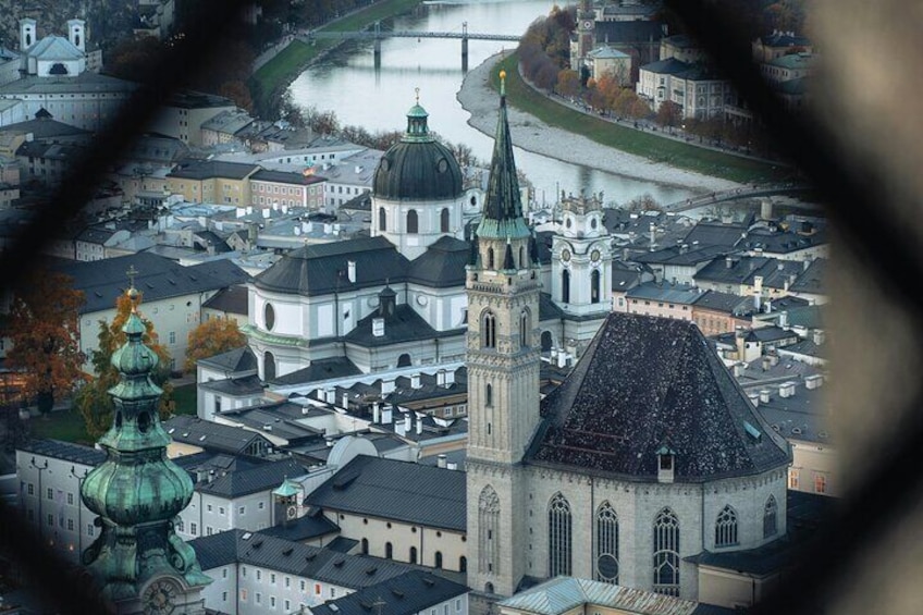 A cityscape with a prominent church and a river. 4