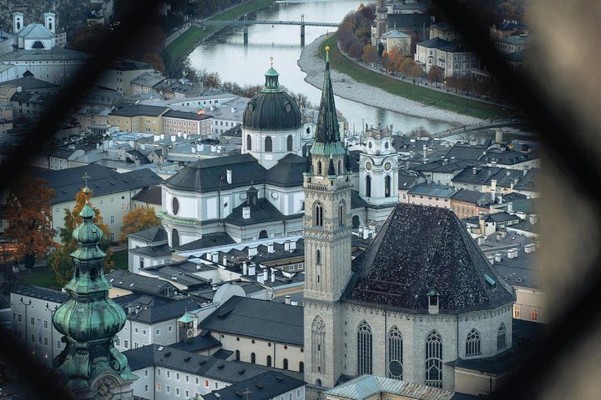 A cityscape with a prominent church and a river. 3