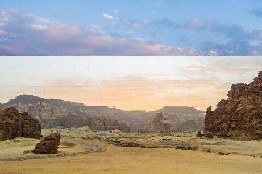 A desert landscape with rocky formations and a winding path. 4
