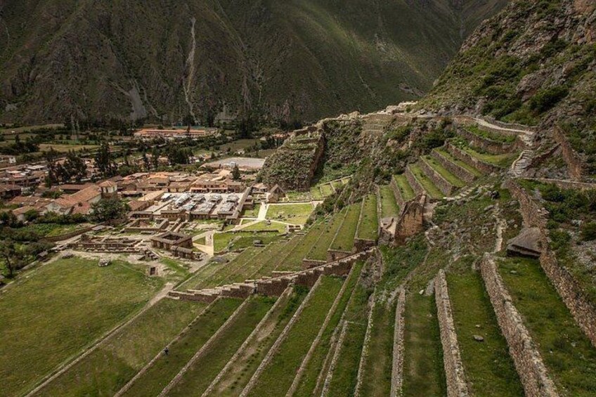 Terraced agricultural fields, ancient ruins, and a mountainous landscape. 2