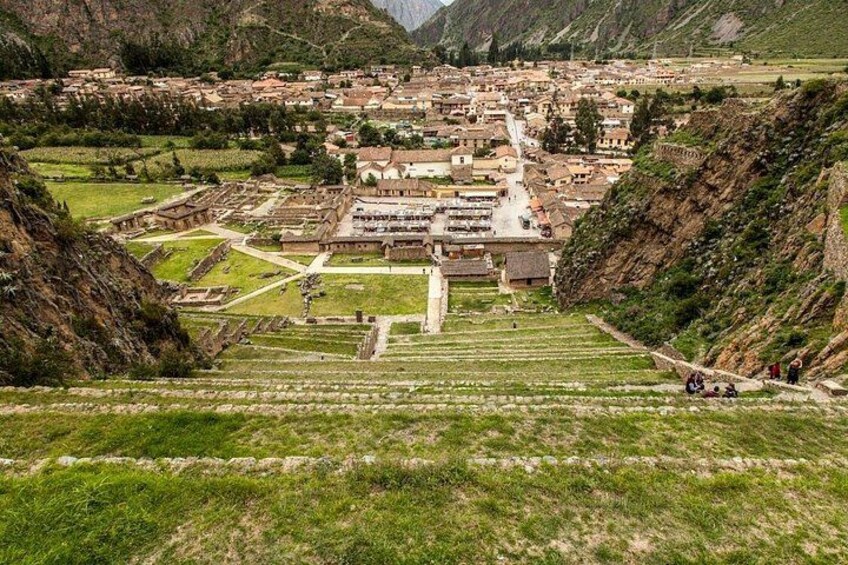 A town nestled in a valley with terraced fields and traditional buildings. 3
