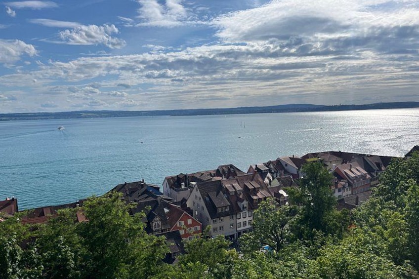 A coastal town with houses and a body of water. 3