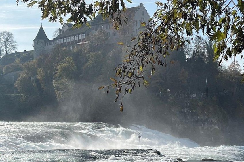 A castle on a hill overlooking a turbulent river. 1