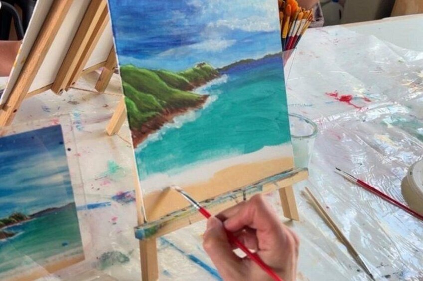 An artist painting a landscape on a canvas. 5