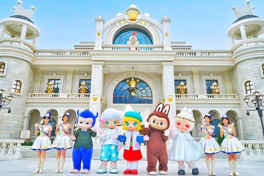 A group of cartoon characters in front of a grand building with a large arched entrance. 1