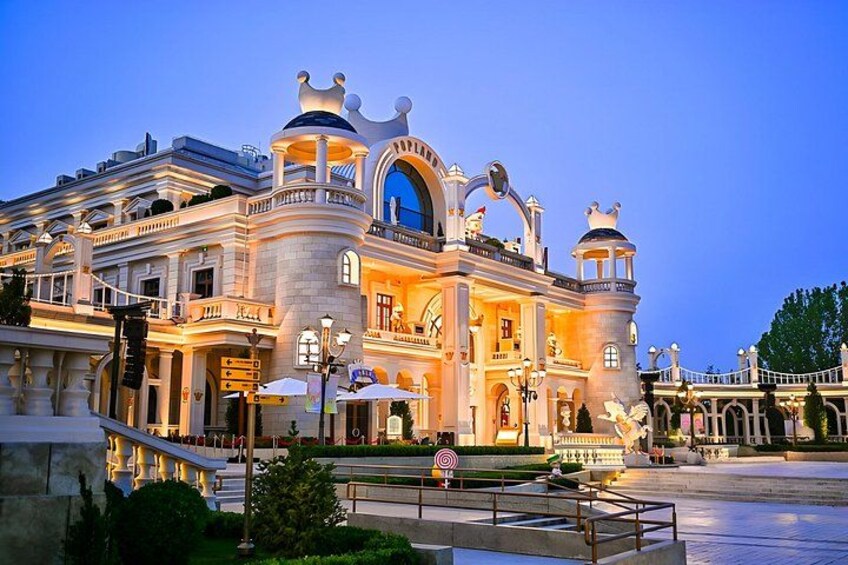 A grand, ornate building with multiple domes and a large arched entrance. 3