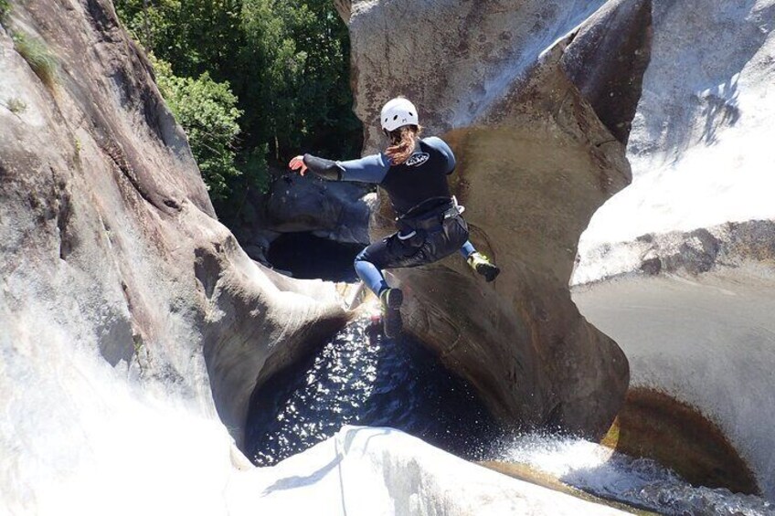 A person rock climbing on a steep rock face. 4