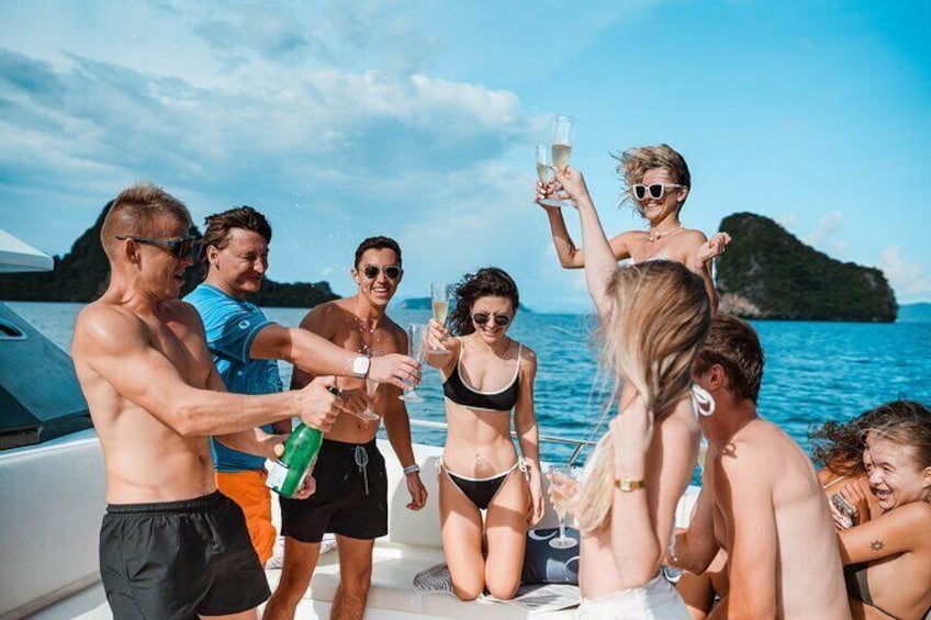 A group of people on a boat, toasting with champagne glasses. 4