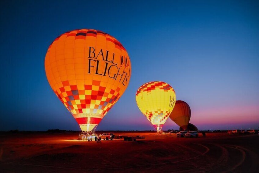 Two hot air balloons with "Ball Flights" branding on them. 1