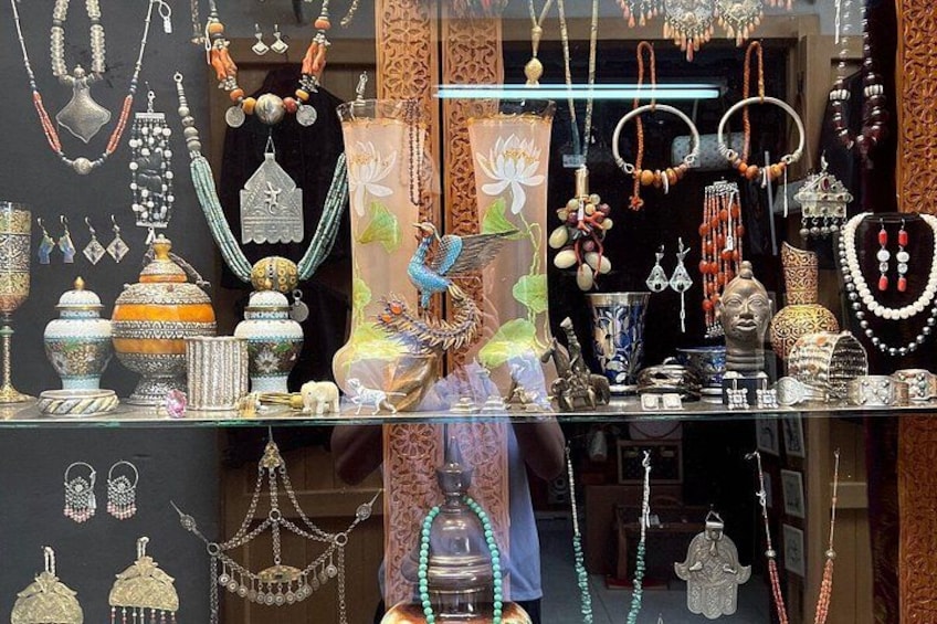 A variety of jewelry displayed on shelves, including necklaces, earrings, and bracelets. 4