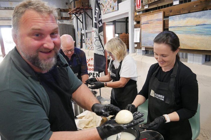 People working with dough in a workshop setting. 5