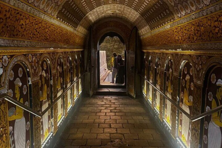 A corridor with ornate arches and detailed wall decorations. 3