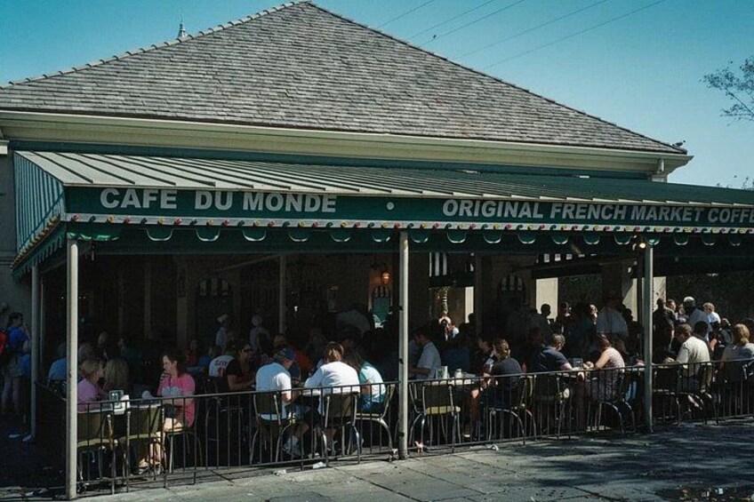 A cafe with outdoor seating and a covered area. 4