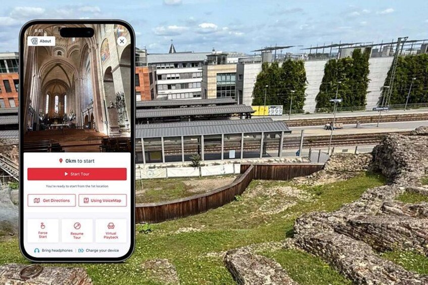 A smartphone displaying a tour app interface with a cathedral and modern buildings in the background. 1