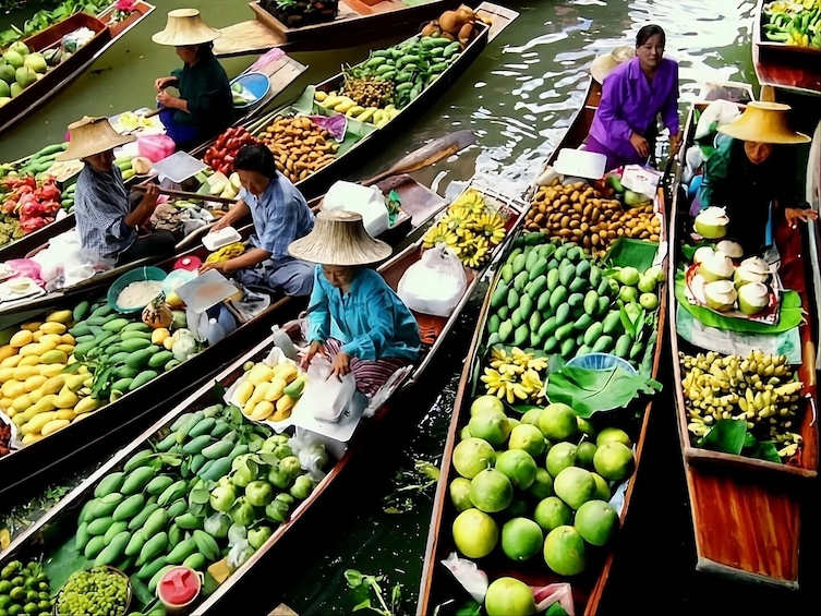 People in boats selling fruits and vegetables. 3