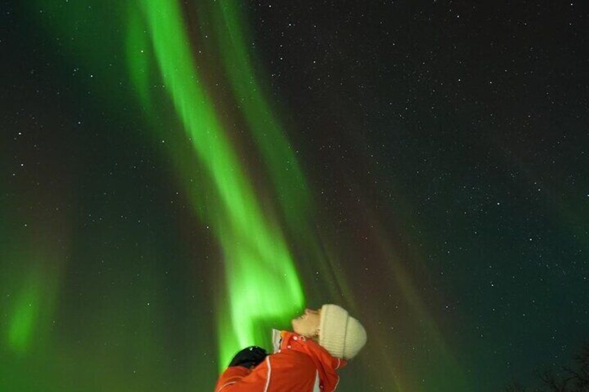 A person taking a photo of the Northern Lights. 1