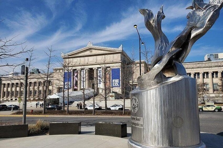 A modern sculpture in front of a classical building with columns. 3