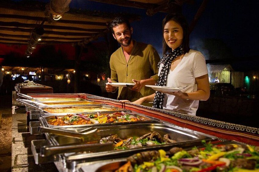 A buffet setup with various food items. 3