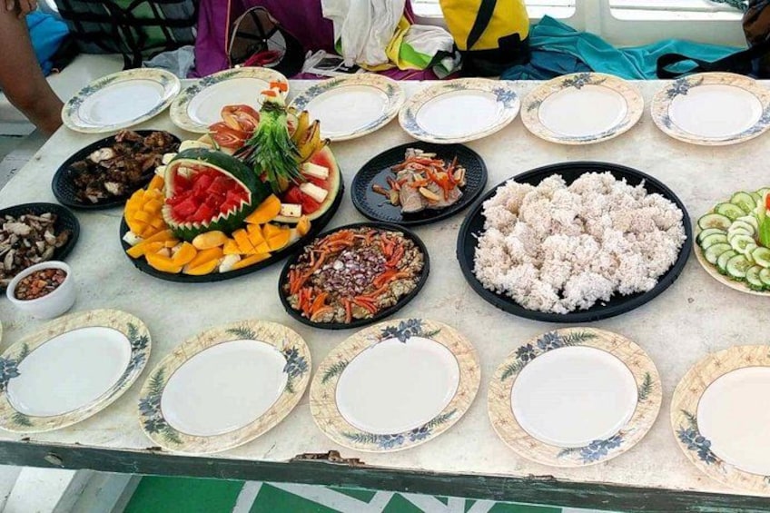 A table with various dishes and plates, some with food and others empty. 5