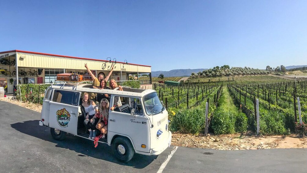 Tour group sitting in a VW Bus visiting a vineyard in Temecula 1