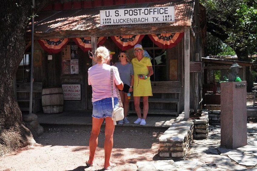 A U.S. Post Office building with a sign indicating its establishment in 1850. 5