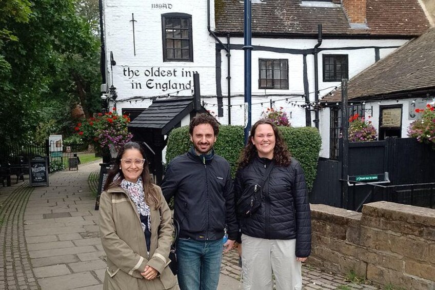 A historic building with a sign stating 'the oldest inn in England.' 1