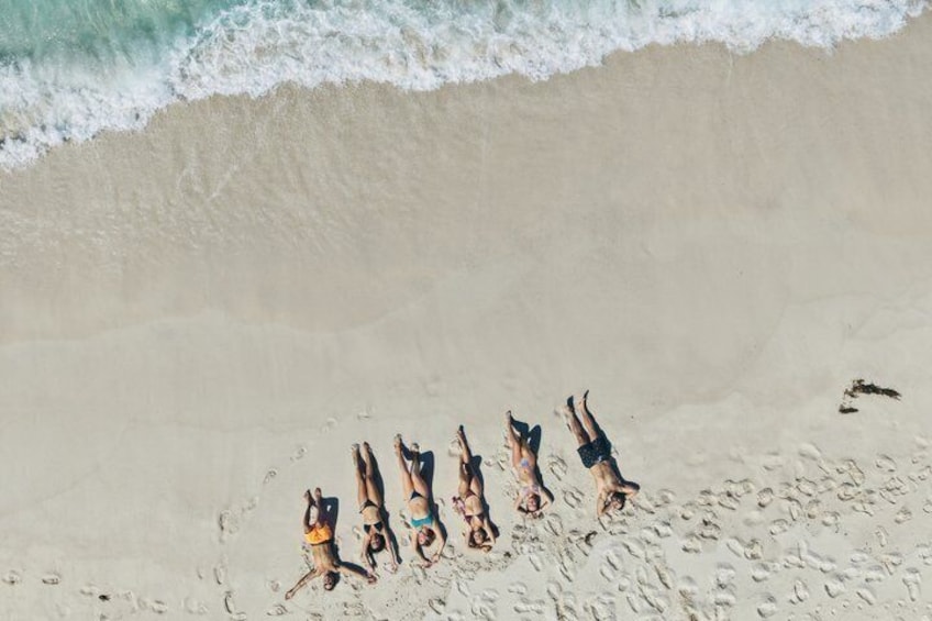 A beach with people sunbathing. 2