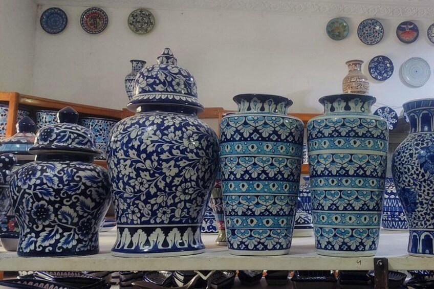 A collection of blue and white patterned vases on display. 3