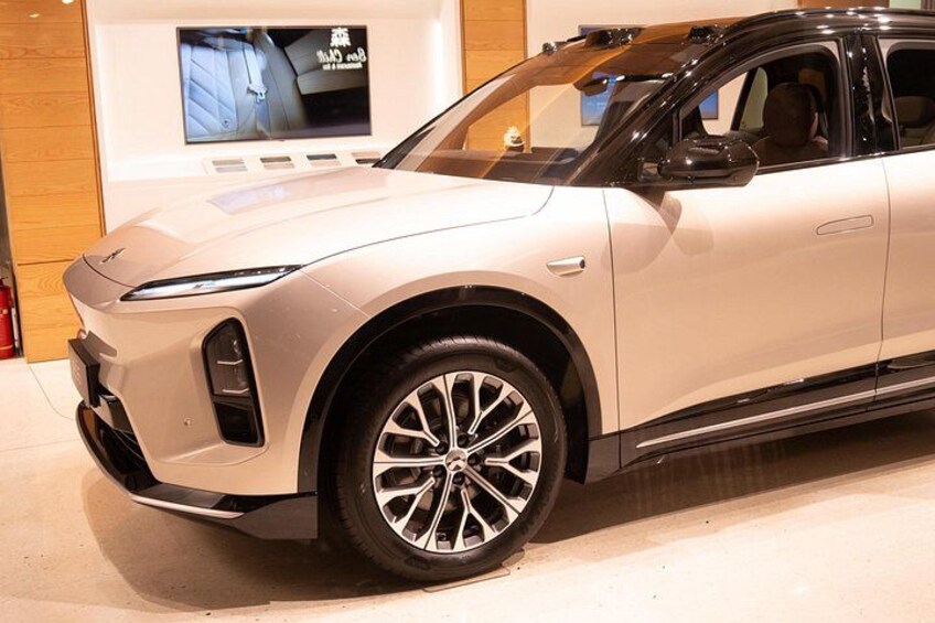 A silver SUV with a modern design, large alloy wheels, and a sunroof. 2