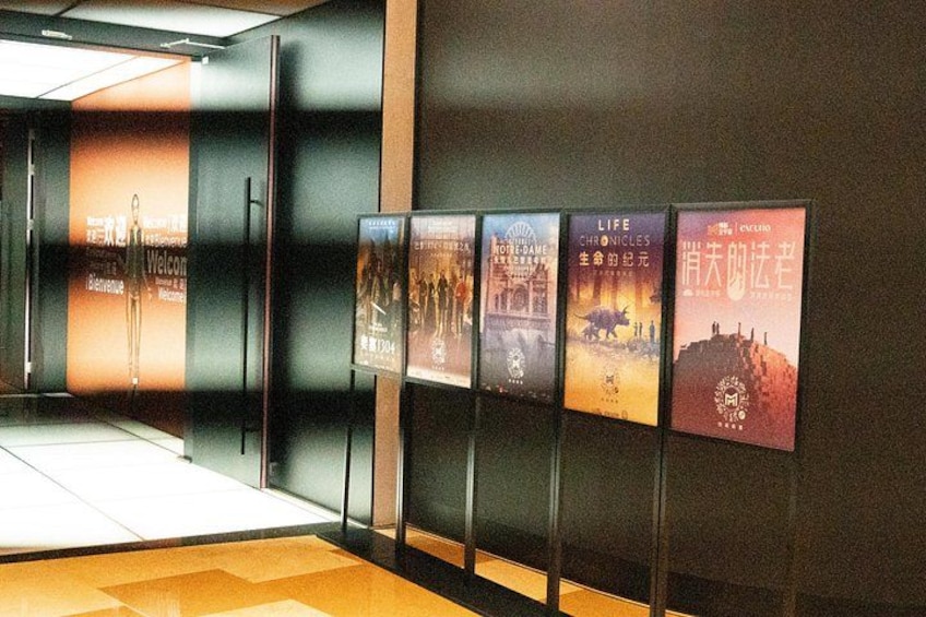 A hallway with posters on the wall. 3