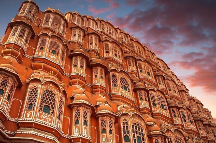 A grand, ornate building with intricate architectural details and multiple windows. 4