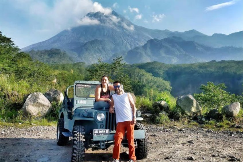 A jeep on a dirt road with a mountainous landscape in the background. 4