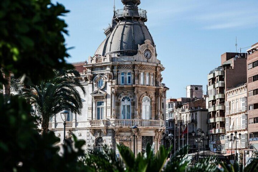 A historic building with ornate architecture and a prominent dome. 1