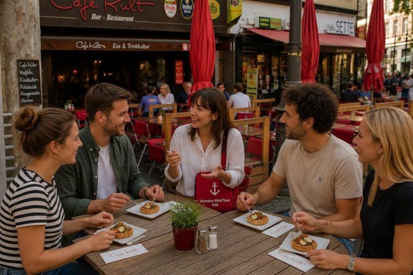 A group of people dining at a cafe with outdoor seating. 5