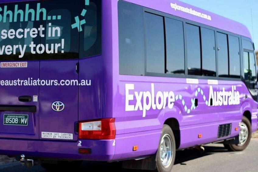 A purple bus with 'Explore Australia' written on the side. 2
