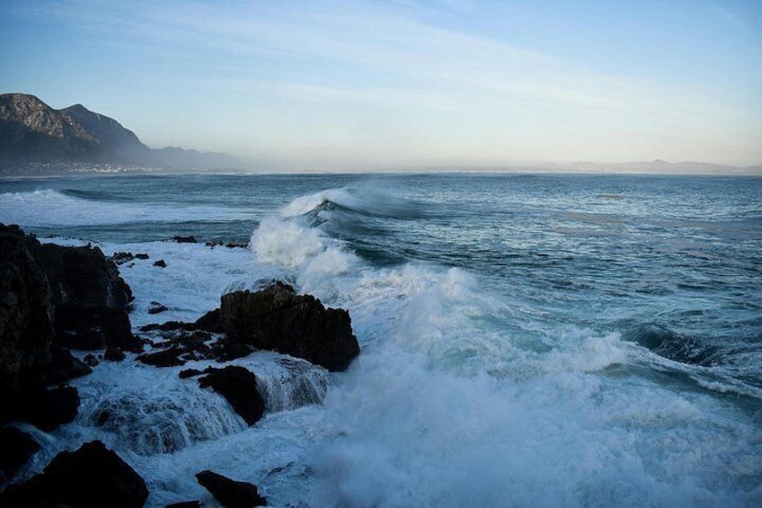 A rocky coastline with waves crashing against the rocks. 2