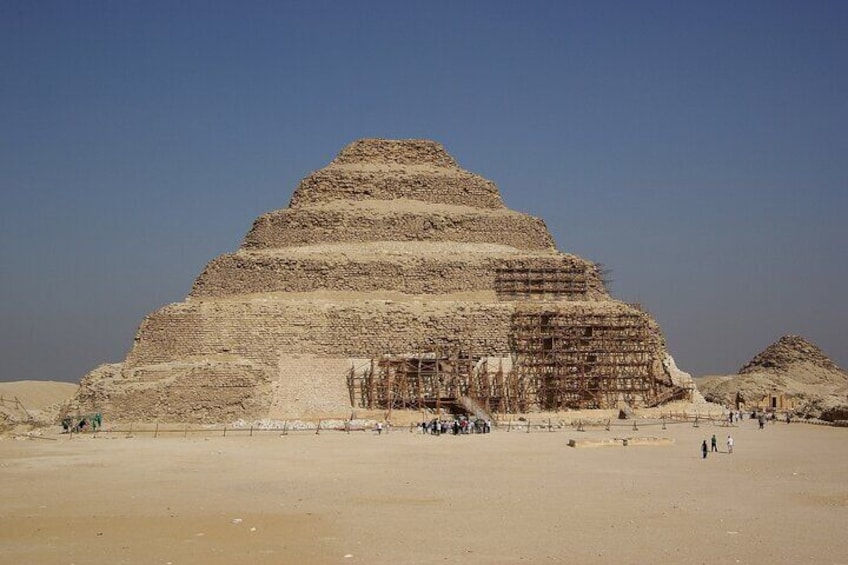 A large pyramid structure in a desert landscape. 3