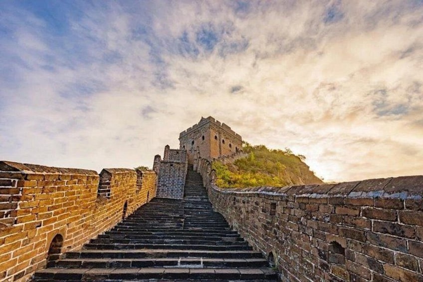 A stone staircase leading up to a large, ancient wall structure. 4
