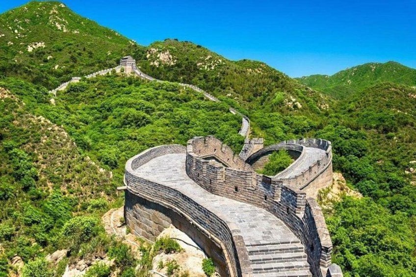 The Great Wall of China winding through a mountainous landscape. 5