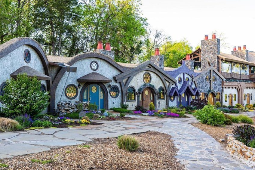 A whimsical house with unique architecture, surrounded by a well-maintained garden. 4