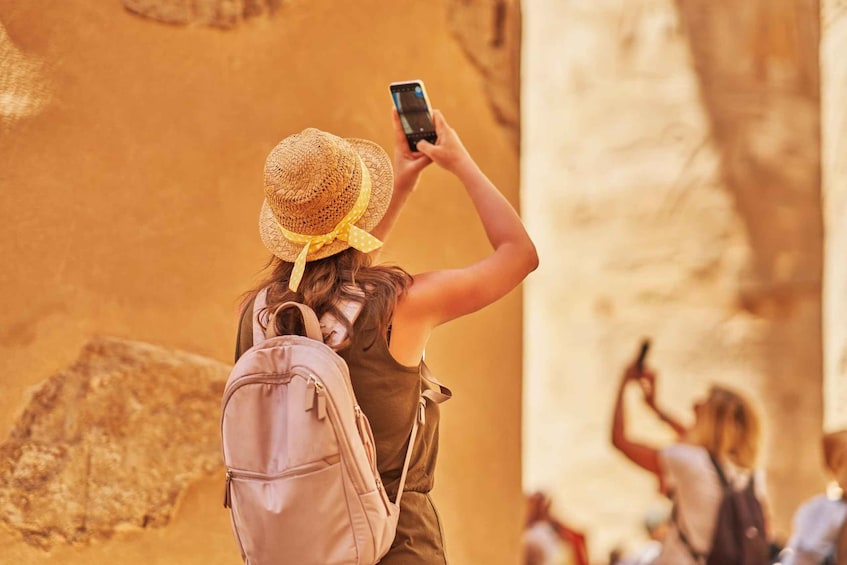 A person taking a photo with a smartphone. 5