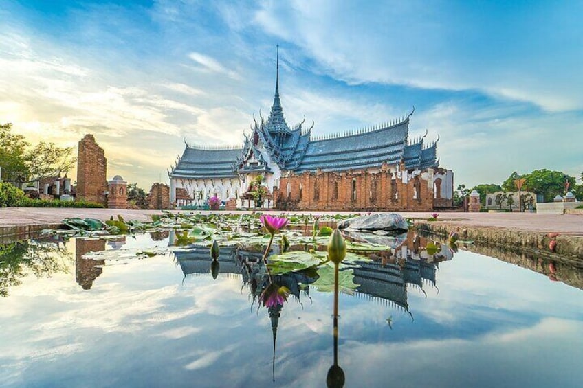A traditional temple with a lotus pond in front. 1