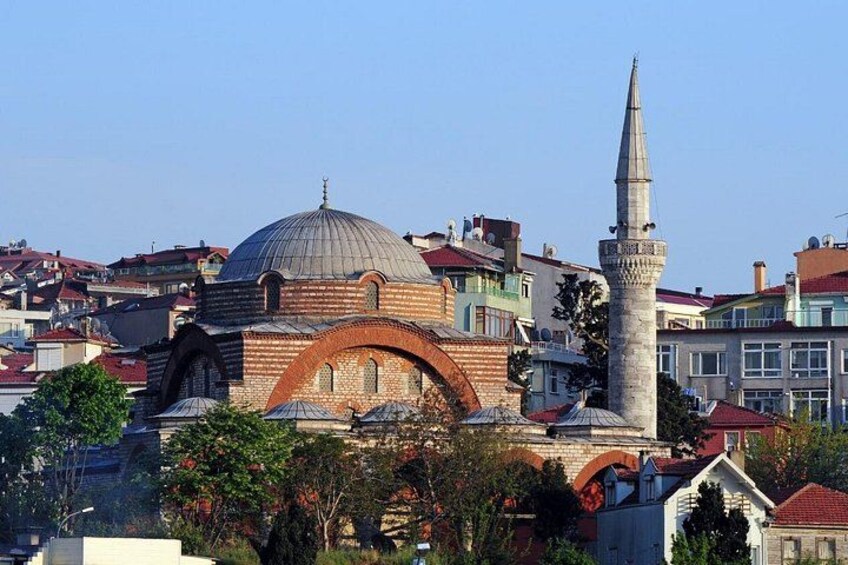 A mosque with a large dome and a minaret. 3